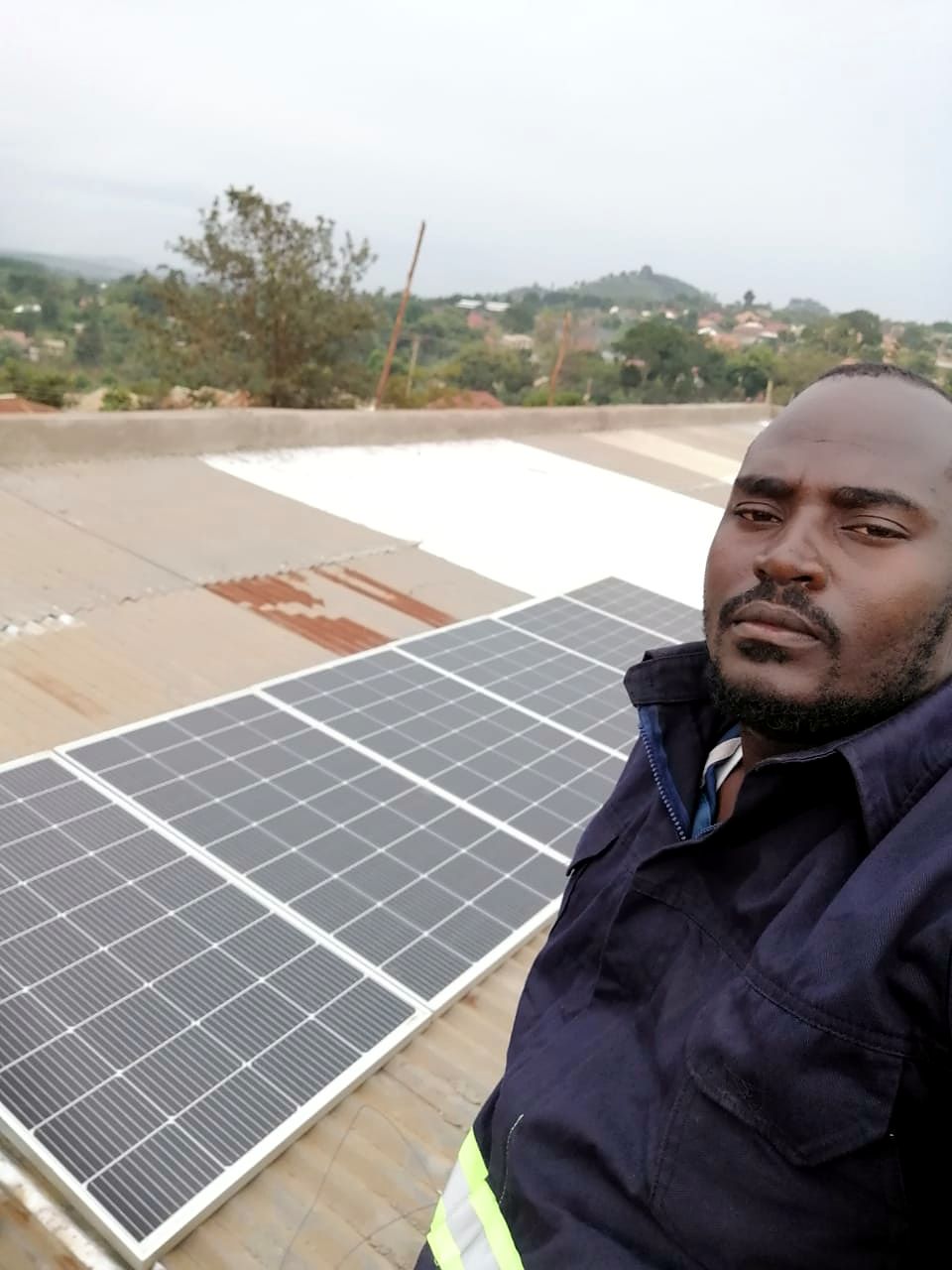 Trivox engineer on site beside a newly installed solar array